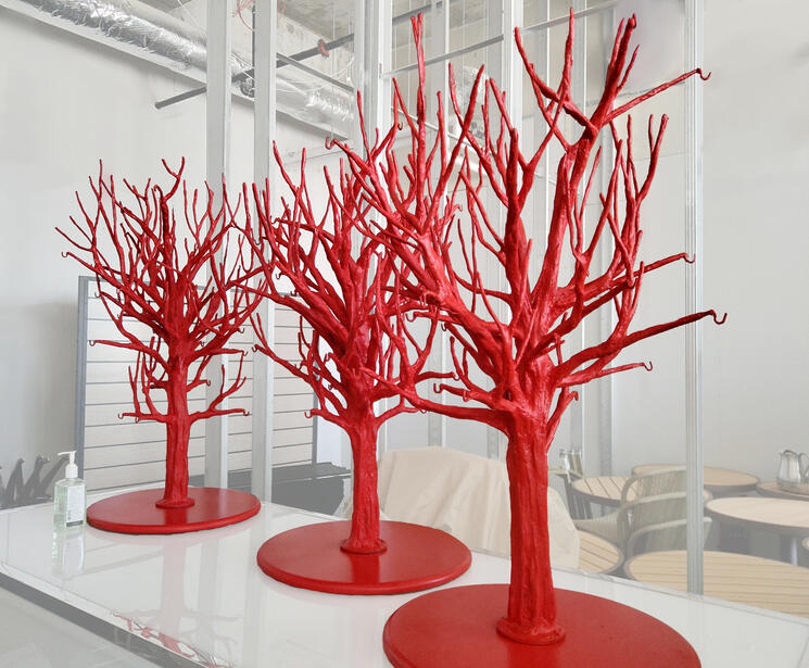 The final trees are able to hold bottles from some branches